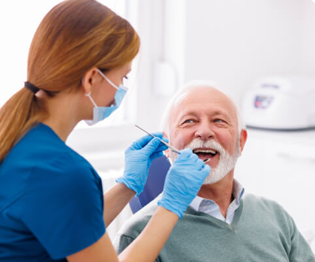 Dental implant specialist Glendale consulting senior man during checkup