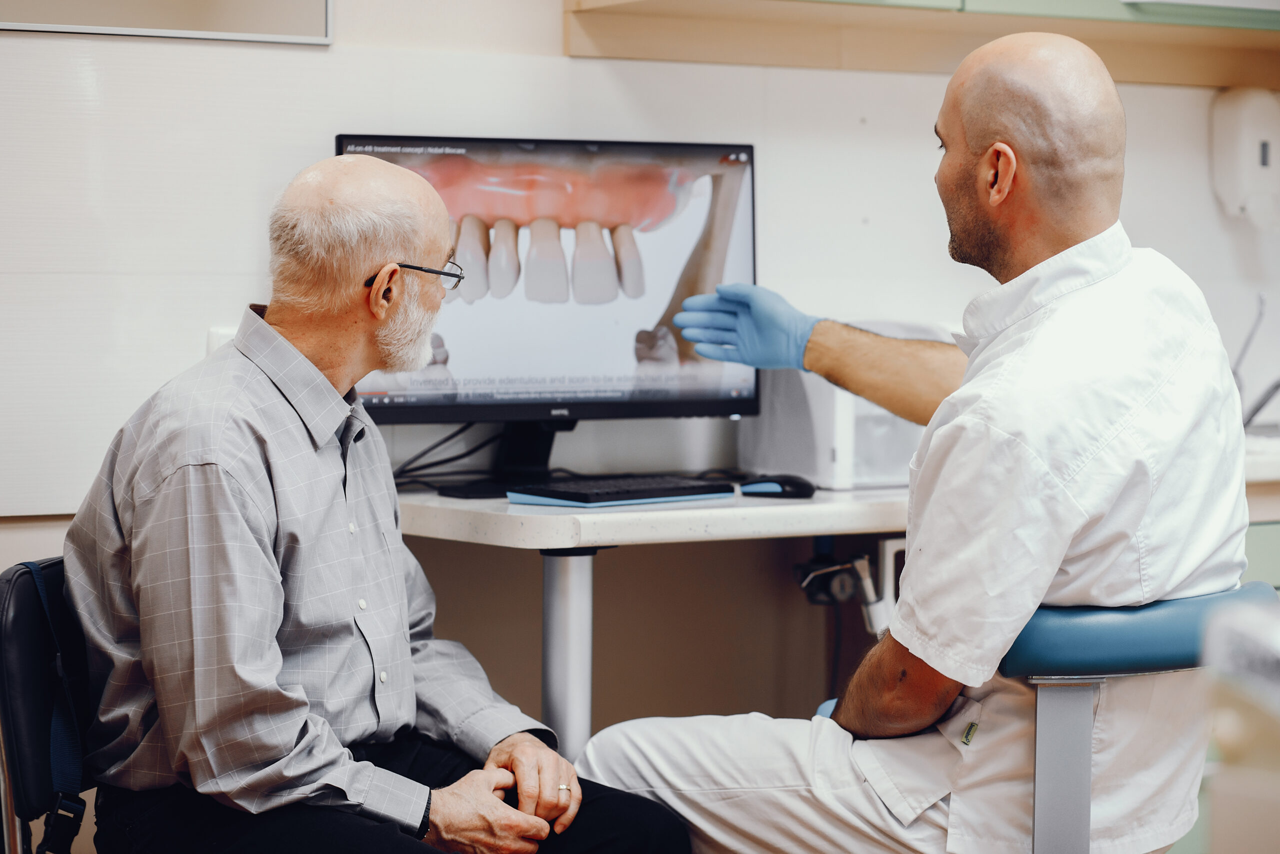 A dentist explaining a simple process for all-on-X dental implants